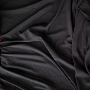 Black stretch silk crepe, Madame Grès – haute couture fabric, 115 cm wide, sold by the meter. Rare silk for draping, only 7 meters available.