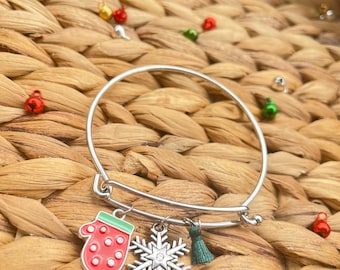 Pulsera con dije de borla de copo de nieve