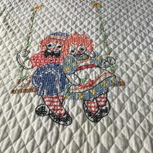 Handmade crib quilt ( Raggedy Ann Andy)