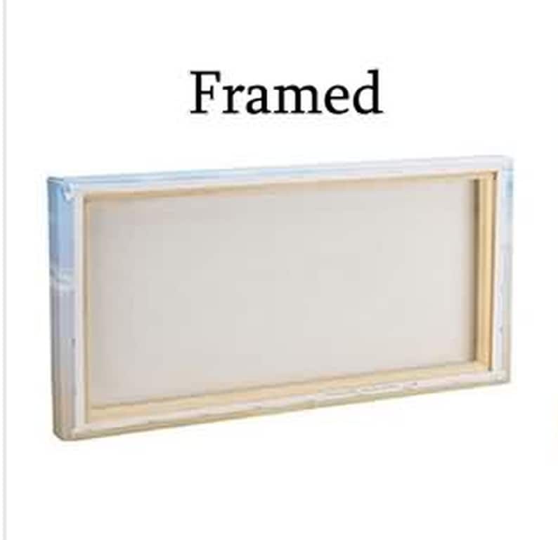 May include: A framed canvas with a light wood frame. The canvas is white and the frame is a light brown color.