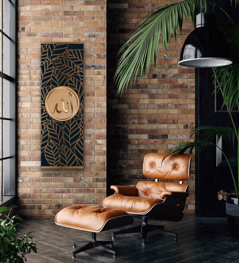 May include: A gold and black wall hanging with a circular design featuring the Arabic word "Allah" in gold lettering. The design is surrounded by a pattern of gold leaves on a black background.