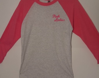 Pink Ladies Scoop Neck Light Ash Size Ladies XS 32" Bust. Pink Ladies Screen Printed on Left Chest & Full Back.