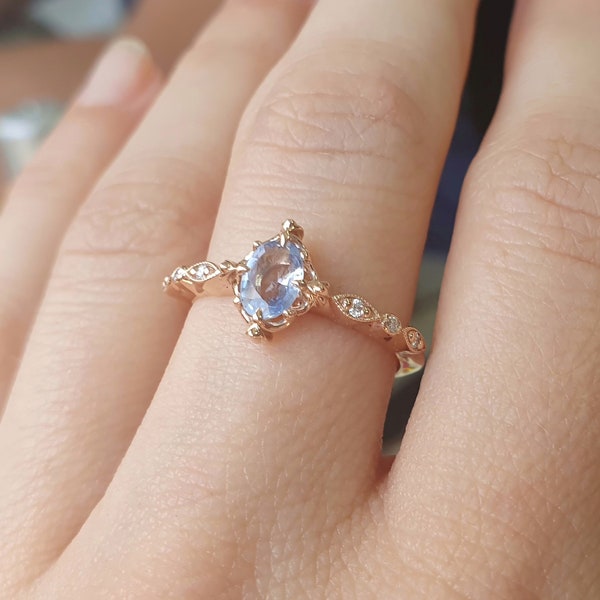 Light blue natural oval cut sapphire ring