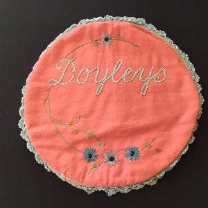 Antique Hand Embroidered Salmon Pink Linen and Cardboard Doily Keeper Linen Press with Blue Crocheted Shell Edging