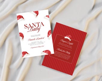 May include: Two baby shower invitations with a Santa theme. One invitation is white with red Santa hats and the words "SANTA BABY". The other is red with a Santa hat and the words "Diaper Raffle" and "Books for Baby".