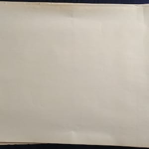 May include: A stack of blank white paper sheets.