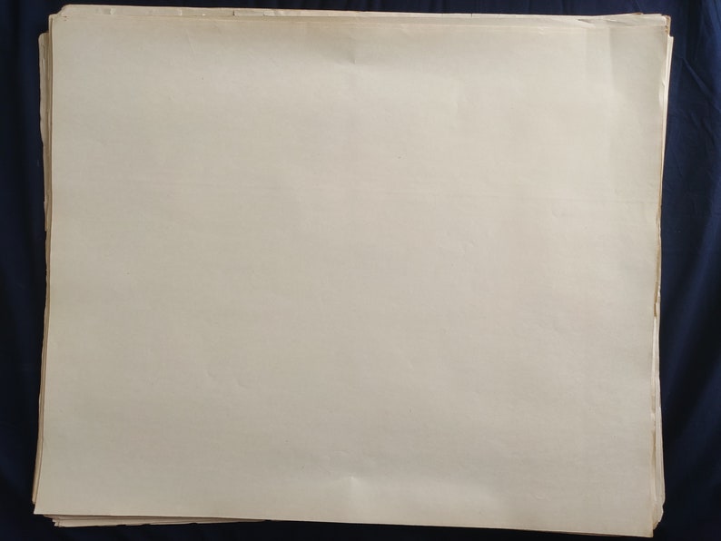 May include: A stack of blank white paper sheets.