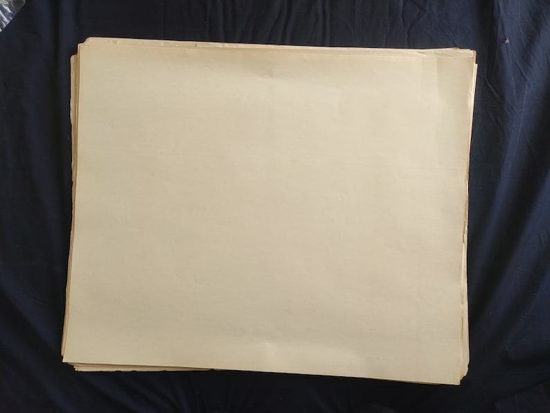 May include: A stack of blank, off-white paper sheets.