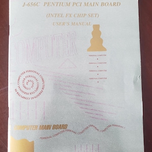 May include: A user's manual for a J-656C Pentium PCI main board, featuring the Intel FX chip set. The cover is light green with gold and purple text and graphics, including the words "COMPUTER" and "PERSONAL COMPUTER".