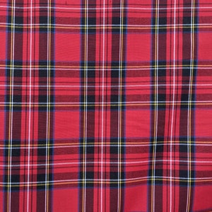 May include: Red fabric with a multi-colored plaid pattern. The pattern includes black, white, yellow, and blue stripes.