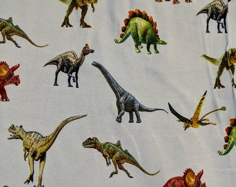 Dinosaur Stretch Cotton Jersey Fabric on a Pale Grey background by the Half Metre or Metre