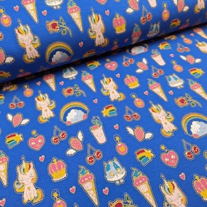May include: Blue fabric with a repeating pattern of gold glitter unicorns, ice cream cones, rainbows, cherries, hearts, and crowns.