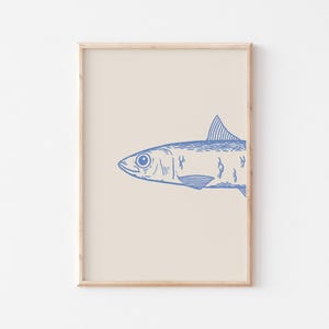May include: A framed print of a blue line drawing of a sardine fish on a cream background.