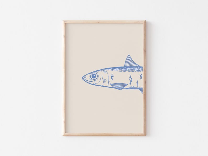 May include: A framed print of a blue line drawing of a sardine fish on a cream background.