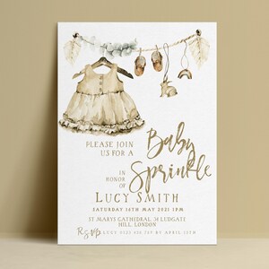 The image is a baby shower invitation featuring a dress and baby shoes, along with a banner that reads "Please join us for a Baby Sprinkle in honor of LUCY SMITH".