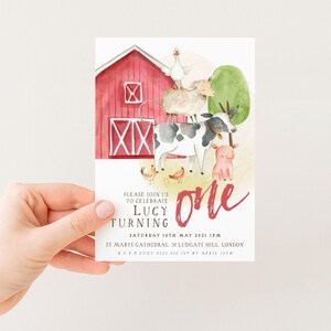 The image is a birthday invitation for a one-year-old named Lucy, featuring a red barn and farm animals such as a cow, pig, and sheep.