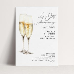 May include: A white invitation card with two champagne flutes filled with bubbly liquid. The text reads "40th Anniversary" and invites guests to celebrate Maize & Johns' wedding anniversary. Includes event details.