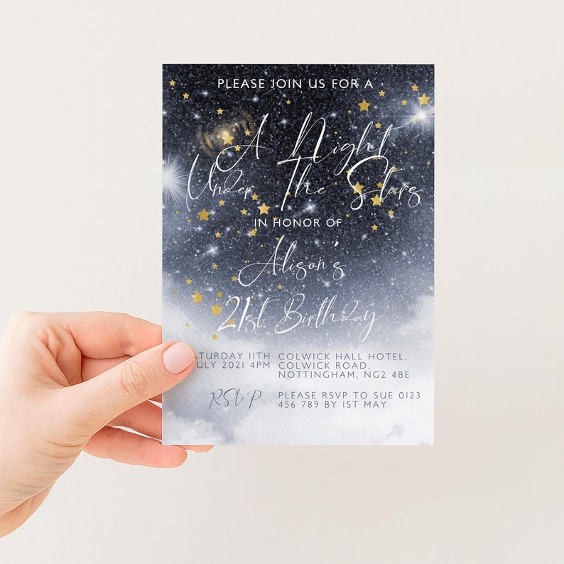 a hand holding a birthday invitation card with a starry night sky background.