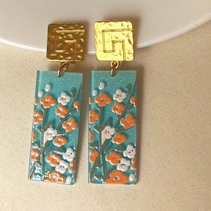 Dangling Plastic Clip On Earrings: Abstract Rectangles, Floral/Daisy Print