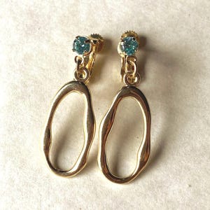Tiny Dangling gold coloured hoop clip on earrings on rhinestone closures