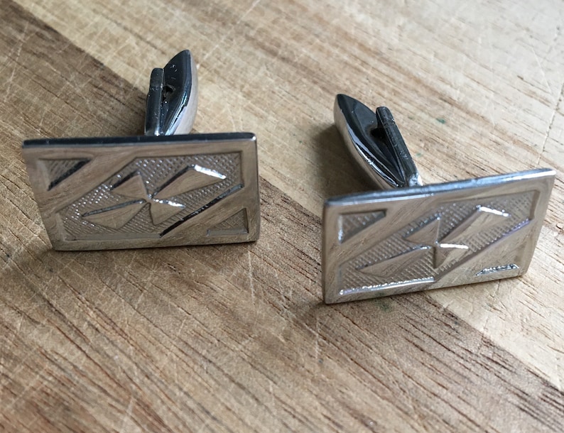 Vintage silver rectangular cuff links with a subtle pattern