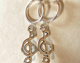 Silver coloured clip on earrings dangling charms on spring hoops (hearts, peace, fox, spider)