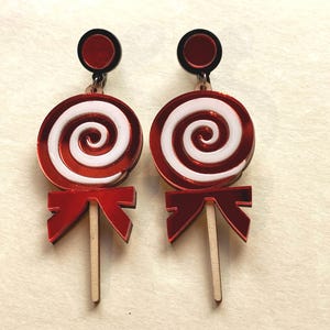 Dangling Christmas candy clip on earrings, giant plastic lollipop earrings with hinged screwback closures.