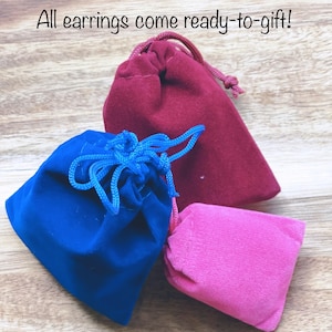 May include: Three velvet pouches in red, blue, and pink. The pouches are ready-to-gift. All earrings come ready-to-gift!