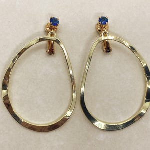 Dangling gold hoop and rhinestone clip on earrings