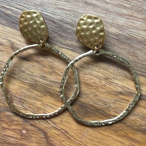 Dangling gold hoop (hammered) clip on earrings