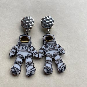 Dangling astronaut clip on earrings, outer space earrings