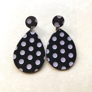 Oversized dangling black and white striped or polka dot plastic teardrop clip on earrings