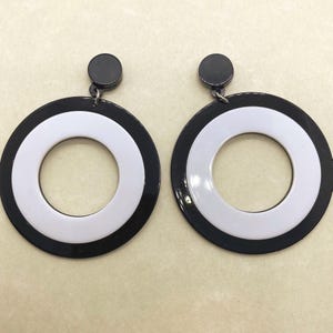 Oversized dangling black and white plastic hoop clip on earrings, dangle screwback hoops