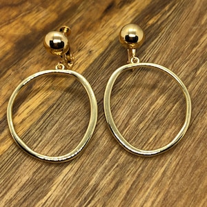 Dangling gold or silver coloured hoop clip on earrings
