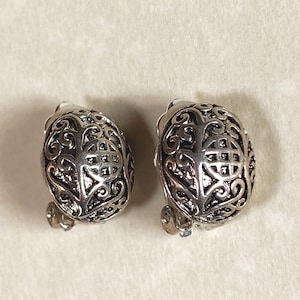 Vintage silver oval patterned clip on dome earrings