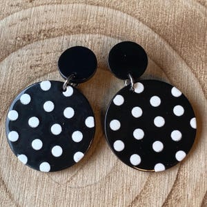 Dangling black and white polka dot clip on earrings