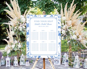 May include: Blue and white floral seating chart with the text "Find Your Seat" and "Rachel's Bridal Shower" on a white background. The chart lists table numbers and guest names.