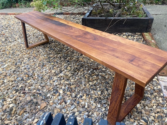 Minimalist Iroko Wood Bench: Natural Oil Finish