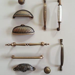 Antique brass handles, pulls, knobs , shell, T bar, bow