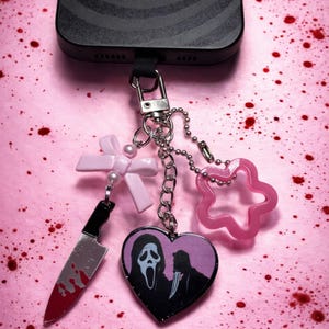 Pink and Black Ghost Face Women\'s Accessory Set with Keychain & Hair Clips Ghost Face Pink Bling Costume Kit - Spirithalloween.com main image 2