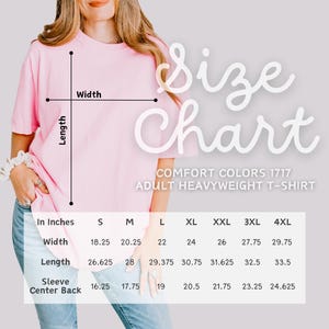 May include: A light pink Comfort Colors 1717 adult heavyweight t-shirt. The image includes a size chart with measurements in inches for width, length, and sleeve center back. Sizes range from S to 4XL.