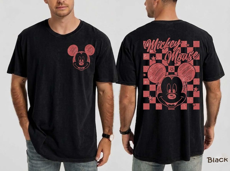 May include: Black t-shirt featuring a red Mickey Mouse graphic on the front and back. The back design includes a checkered pattern and the words "Mickey Mouse". The shirt has a vintage, distressed look.