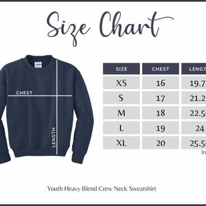 May include: Navy blue Youth Heavy Blend Crew Neck Sweatshirt with a size chart. The chart shows chest and length measurements in inches for sizes XS to XL. The sweatshirt has a crew neck and long sleeves.