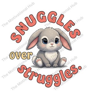 May include: A cute cartoon bunny with big blue eyes and gray fur is featured in this image. The text "SNUGGLES over struggles" is written in a playful font around the bunny. The design is on a white background.