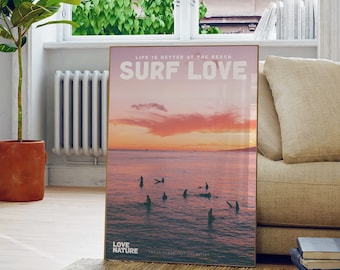 May include: A poster featuring a sunset over the ocean with surfers in the water. The text on the poster reads "Life is better at the beach Surf Love Love Nature".