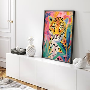 May include: A colorful painting of a leopard with a pink, yellow, and green background. The leopard is surrounded by tropical leaves and flowers.