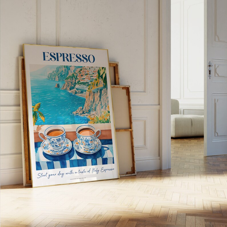 May include: A poster with a watercolor illustration of a coastal Italian landscape with two cups of espresso on a striped table cloth. The poster has the text "ESPRESSO" in large blue letters and the text "Start your day with a taste of Italy Espresso" in smaller blue letters.