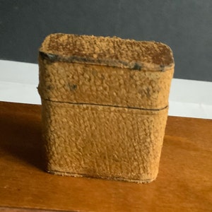 Metal vesta case in leather case