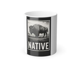 May include: White ceramic mug with a black and white graphic of a bison on a grassy plain. The word "NATIVE" is printed in bold white letters on the mug.