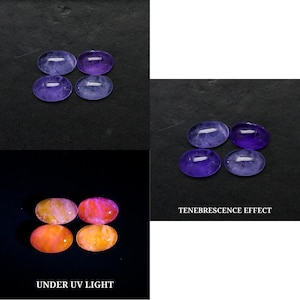 May include: Six oval-shaped gemstones in shades of purple and lavender are displayed on a black surface. The image also shows the gemstones under UV light, displaying orange and pink hues. The text "Tenebrescence Effect" and "Under UV Light" are included.